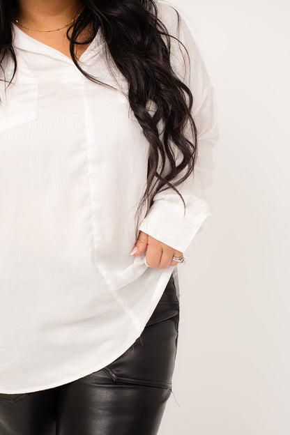 This striped oversize shirt top is made from sleek satin fabric, creating a sophisticated look. The oversized fit adds a touch of modernity, making it a versatile piece for any wardrobe. The fabric's smooth texture and stylish pattern combine to elevate any outfit.