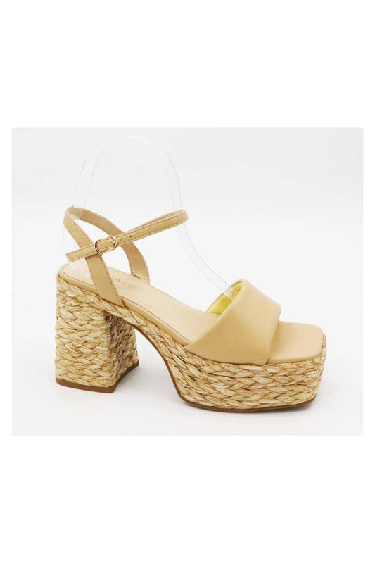 Elevate your style with our Raffia Platform Wedges. The natural material and classic square toe add a touch of elegance, while the wedges offer both fashion and comfort. Perfect for any occasion, these wedges will elevate any outfit.