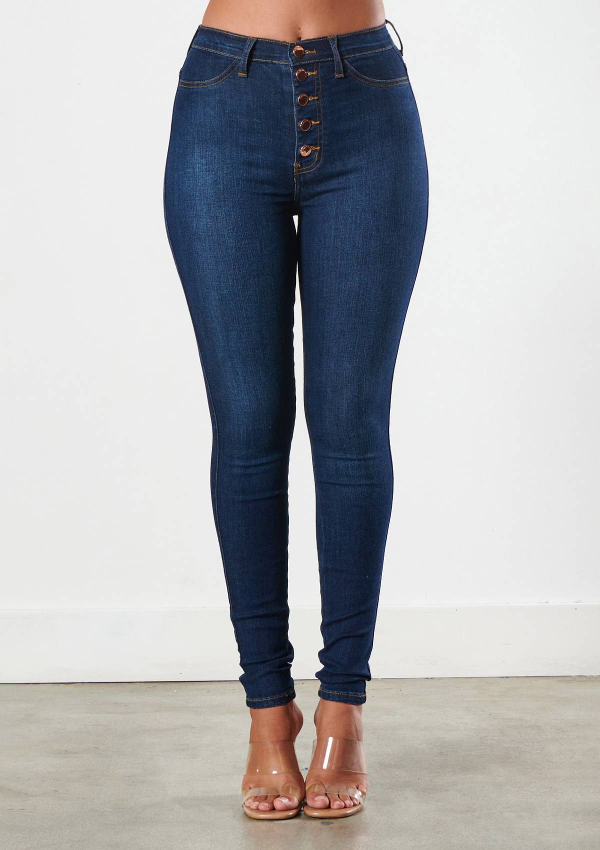 Crafted with expert precision, our High Five Skinny Jeans offer a flattering high-waisted fit and sleek skinny style. The 5 button design adds a touch of unique detail. Experience confident comfort and effortless style with these must-have jeans.