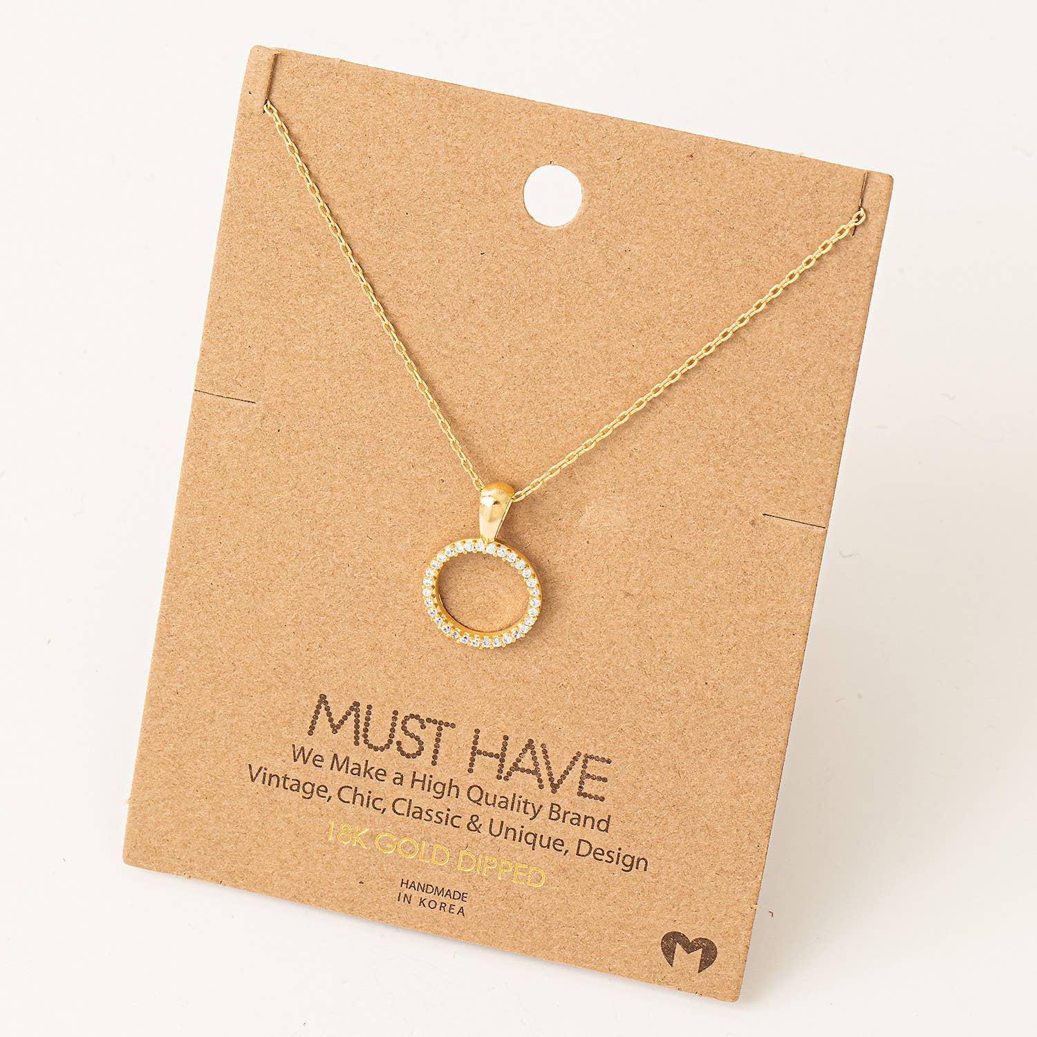 This gold dainty pave circle cutout pendant necklace is a perfect addition to your jewelry collection. Made with 18k gold and rhodium plating, it shines beautifully and adds a touch of elegance to any outfit. The necklace's approximate length of 16" makes it a versatile piece that can be worn for any occasion.