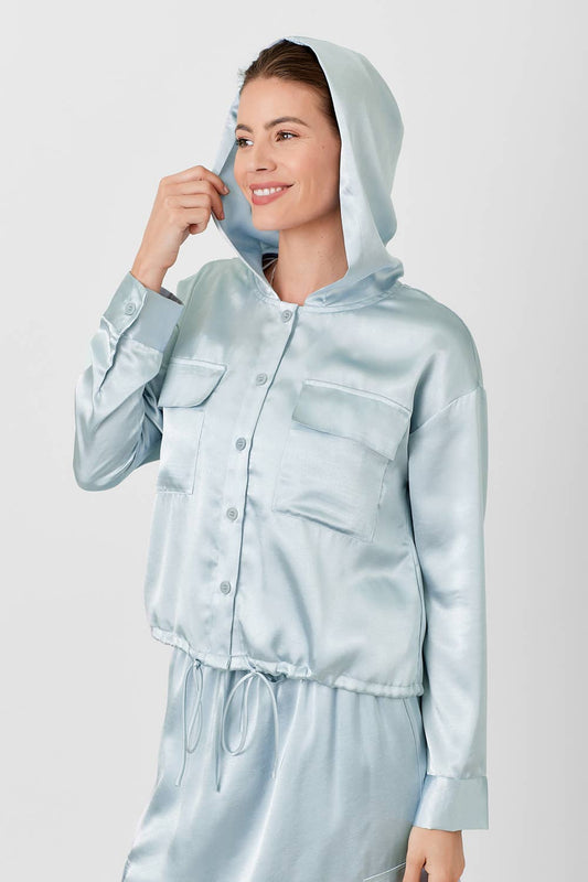 Achieve effortless style and comfort with our Powder Blue Hoodie Blouse. Made with satin and featuring an adjustable bottom, drawstring waist, and button-down design, it's the perfect combination of chic and casual. Complete the look with the matching maxi skirt (sold separately). Model is wearing size S and is 5'9".