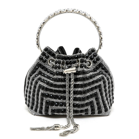 The Black Crystal Handbag is the perfect accessory for any formal occasion. The sleek black design, combined with sparkling crystal accents, adds a touch of elegance and sophistication to any outfit. With its spacious interior, this handbag is both stylish and functional. Elevate your style game with this must-have accessory.