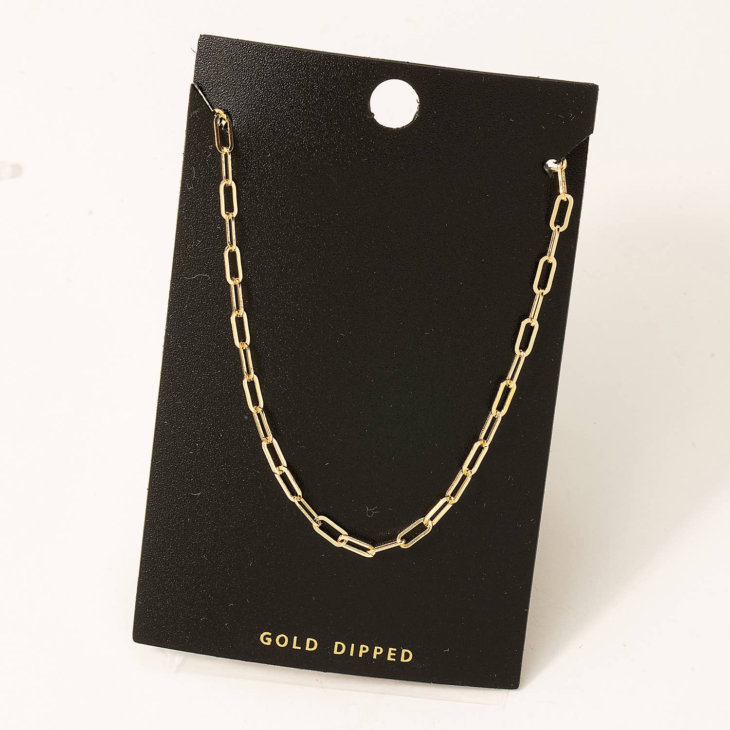 Enhance your style with our Gold Dipped Chain Link Necklace. Expertly crafted, this necklace features a stunning gold dipped chain link design, providing a luxurious touch to any outfit. Measuring 13 inches in length, it is the perfect addition to your jewelry collection. Elevate your look today.