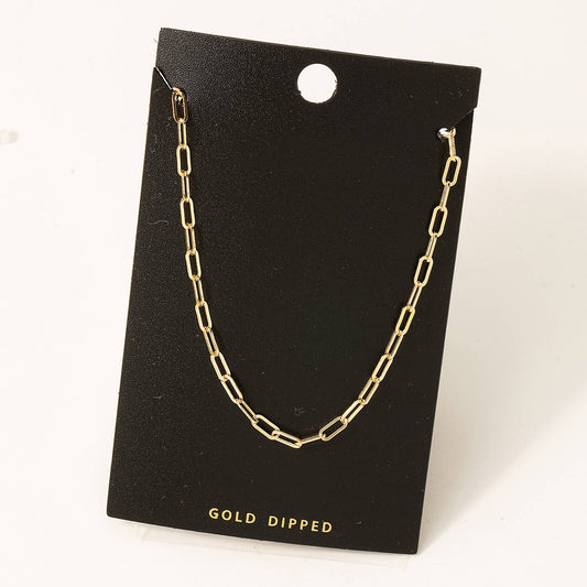 Enhance your style with our Gold Dipped Chain Link Necklace. Expertly crafted, this necklace features a stunning gold dipped chain link design, providing a luxurious touch to any outfit. Measuring 13 inches in length, it is the perfect addition to your jewelry collection. Elevate your look today.