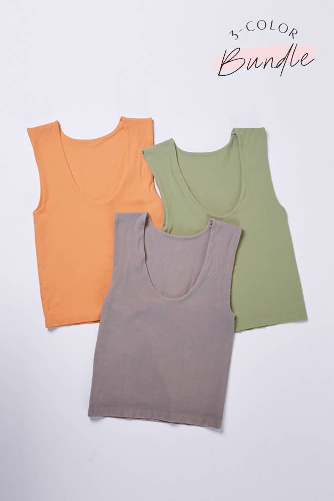 Expertly crafted for comfort and versatility, the Takes Two Tank is the ultimate addition to your wardrobe. Made with a double layered seamless design offering the colors of light taupe, neon orange, and avocado tanks offers a flattering fit and durable knit nylon spandex material. Elevate your style with ease.